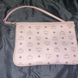 Small pink MCM wallet bag.